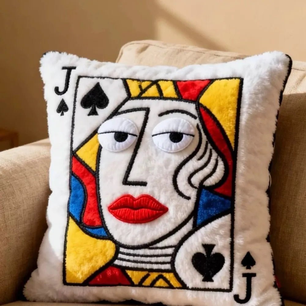 Funny Royal Card Pillows Jack design styled on a beige sofa with bold red, blue, and yellow accents