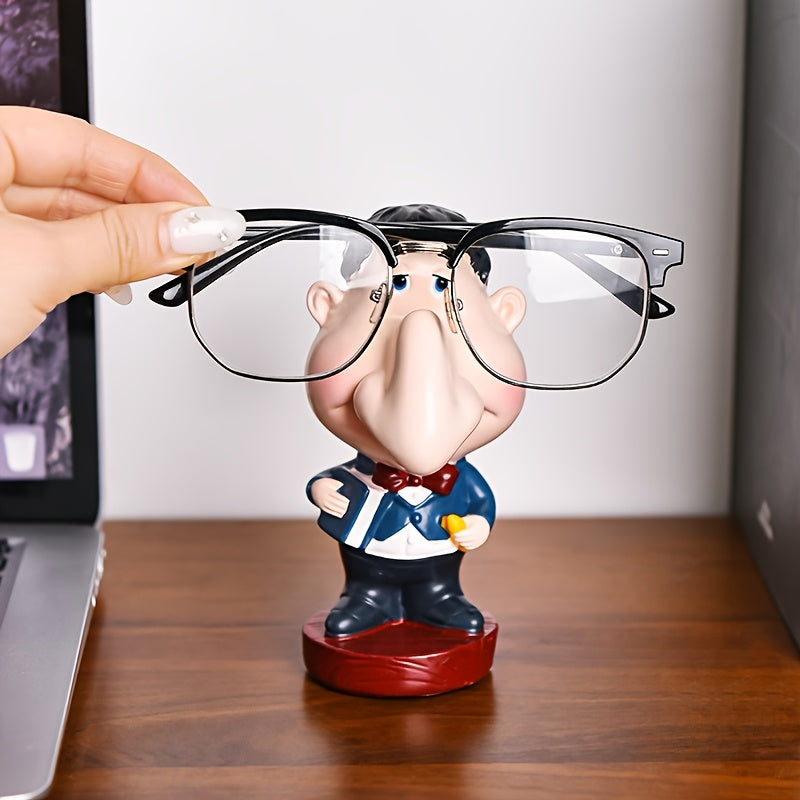 Funny Teacher Glasses Stand on a wooden desk as a hand places black eyeglasses across the character's face