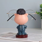 Funny Teacher Glasses Stand rear view showing the character, round base, and eyeglass arms from behind