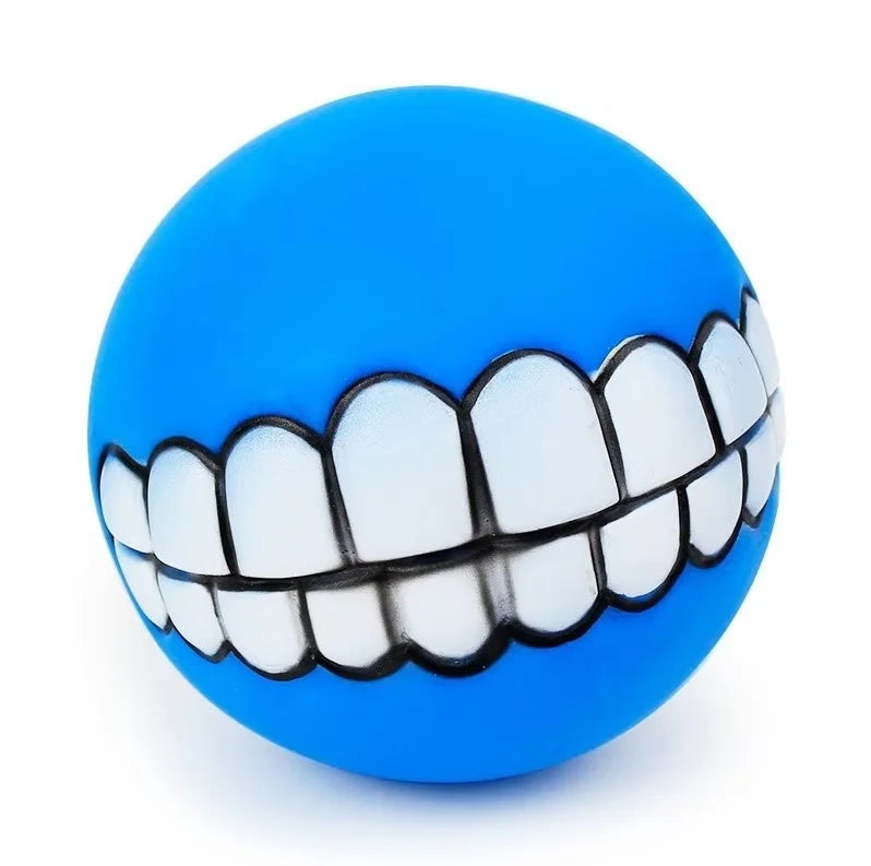 Funny Teeth Dog Balls blue ball close-up with a wide white grin and black tooth outlines.