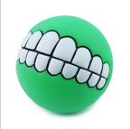 Funny Teeth Dog Balls green ball at a slight angle showing the white cartoon teeth.