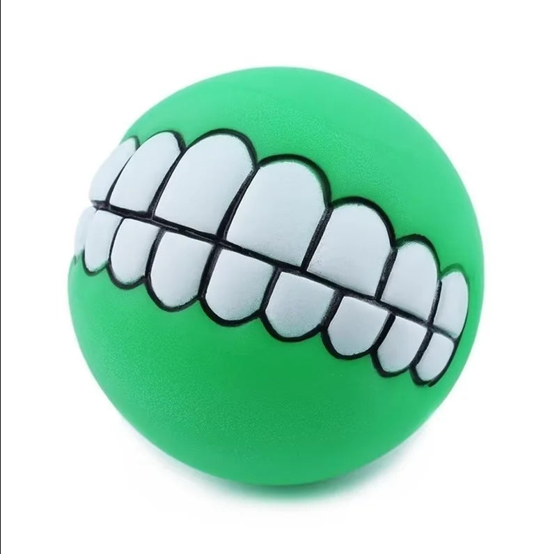 Funny Teeth Dog Balls green ball at a slight angle showing the white cartoon teeth.