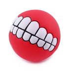 Funny Teeth Dog Balls red ball on a white background showing the two rows of novelty teeth.