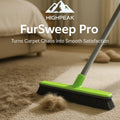 HighPeak FurSweep Pro green broom with soft black bristles sweeping dog hair from beige carpet in living room