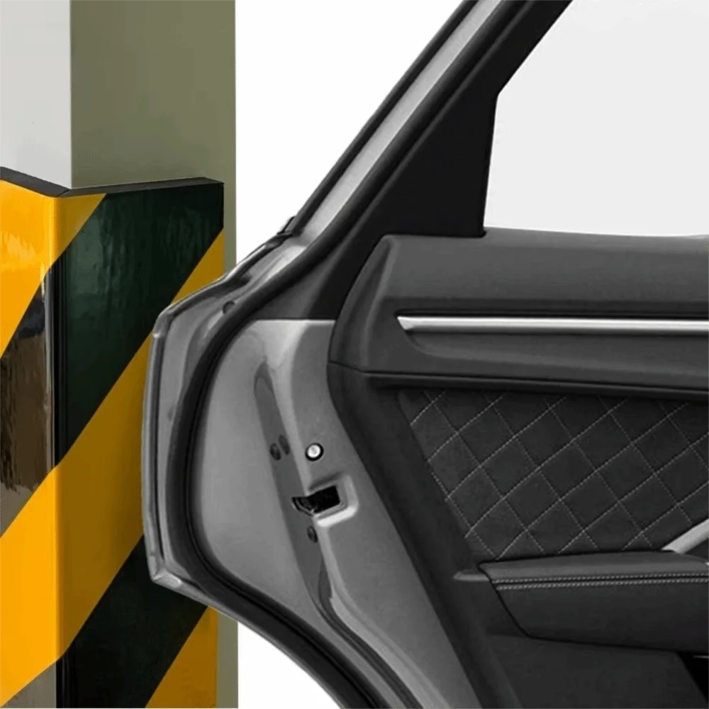 Garage Wall Protection Strip on a pillar corner beside the edge of an open silver car door