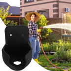 Garden Hose Nozzle Holder in black displayed beside a gardener watering plants with a hose