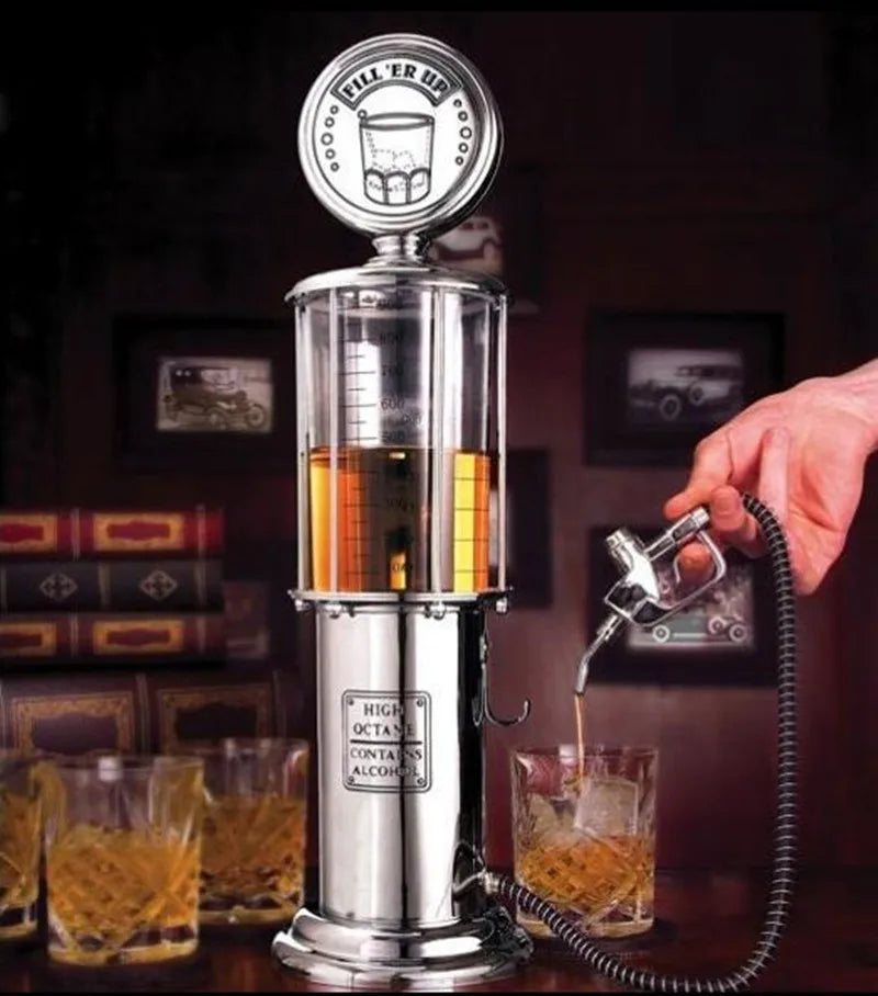 Gas Pump Drink Dispenser pouring an amber drink through its handheld nozzle into a glass at a home bar