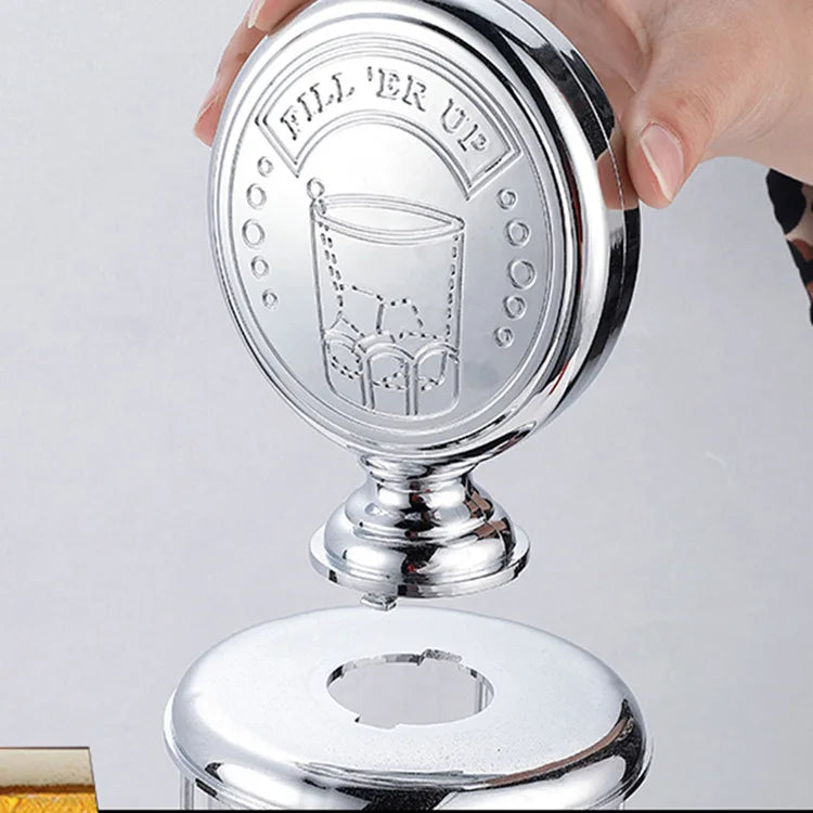 Gas Pump Drink Dispenser round topper being lifted from the lid, showing the connection underneath