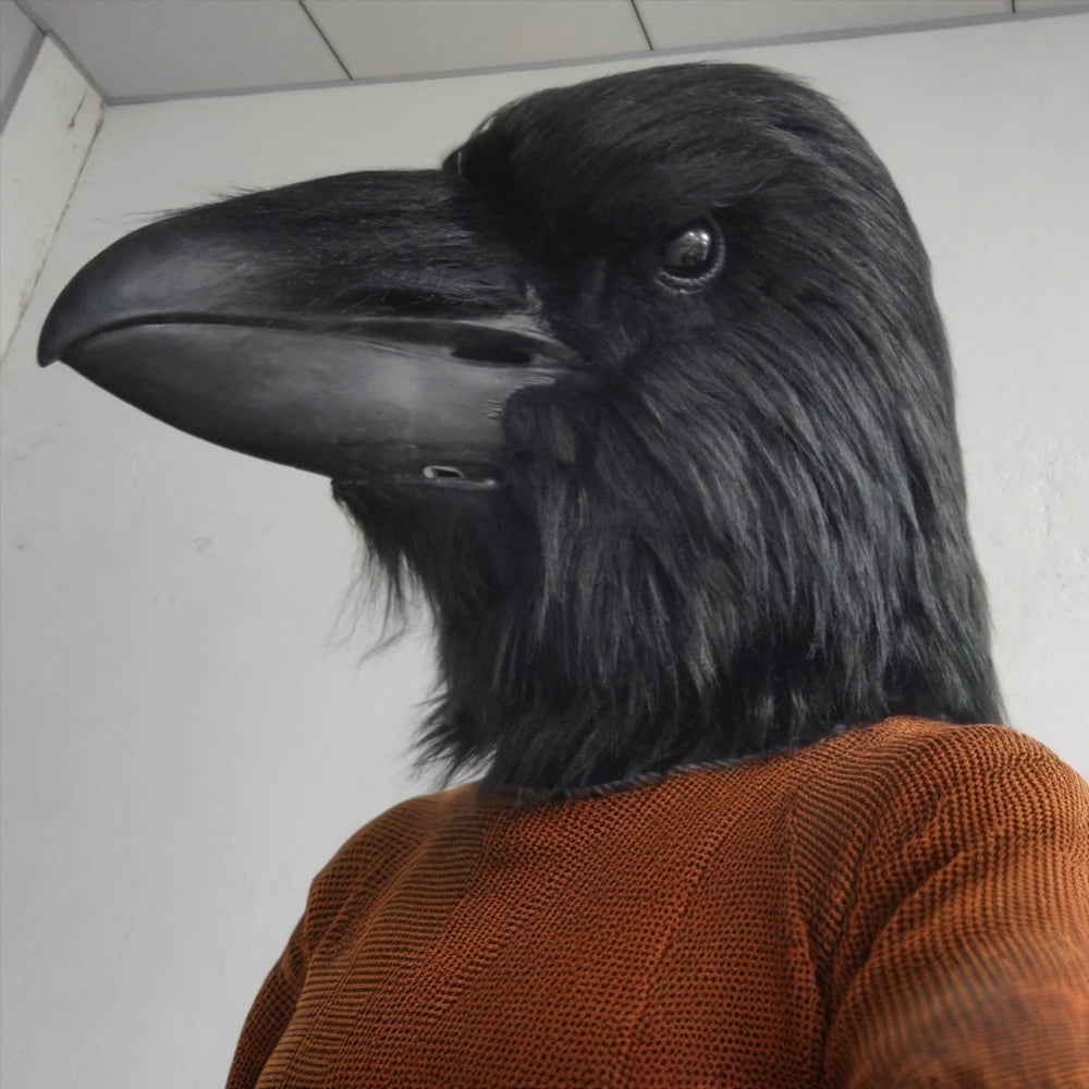 Giant Crow Head Mask left-profile detail showing the bird eye, shaggy black covering and sculpted beak.