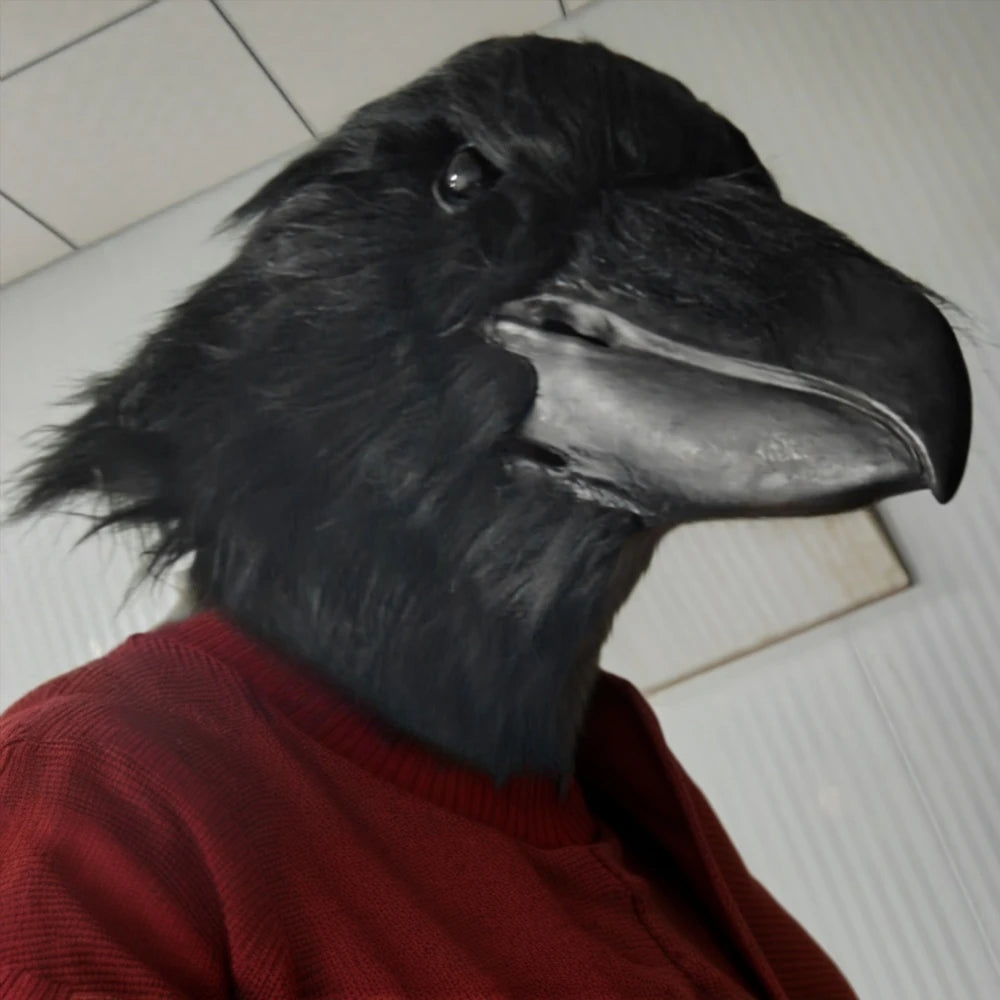 Giant Crow Head Mask viewed from a low angle on the right side, worn with a red sweater.