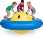 Giant Inflatable Dome Rocker with three children playing on the blue ring around its yellow center