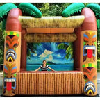 Giant Inflatable Tiki Bar outdoors with palm-tree tops, tiki-mask pillars and a bamboo-look front