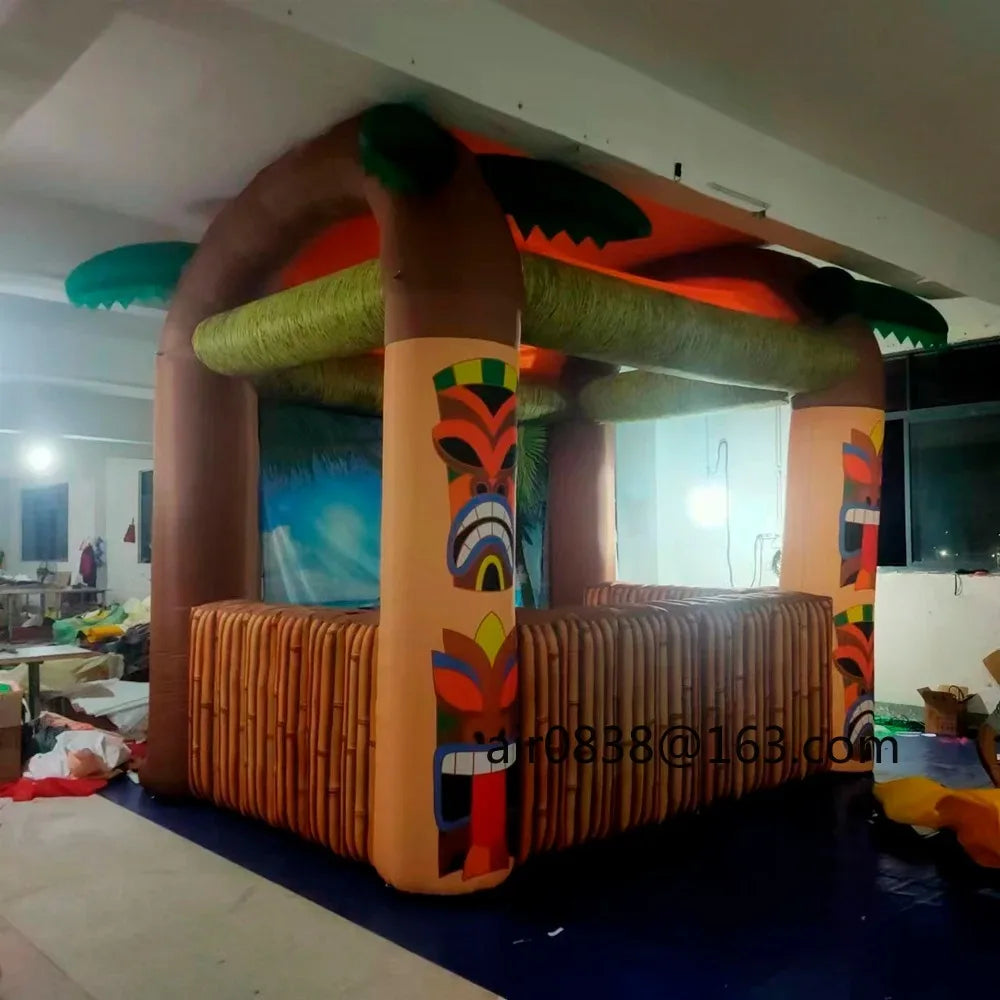 Giant Inflatable Tiki Bar three-quarter view showing the side return, roof and tiki-face columns