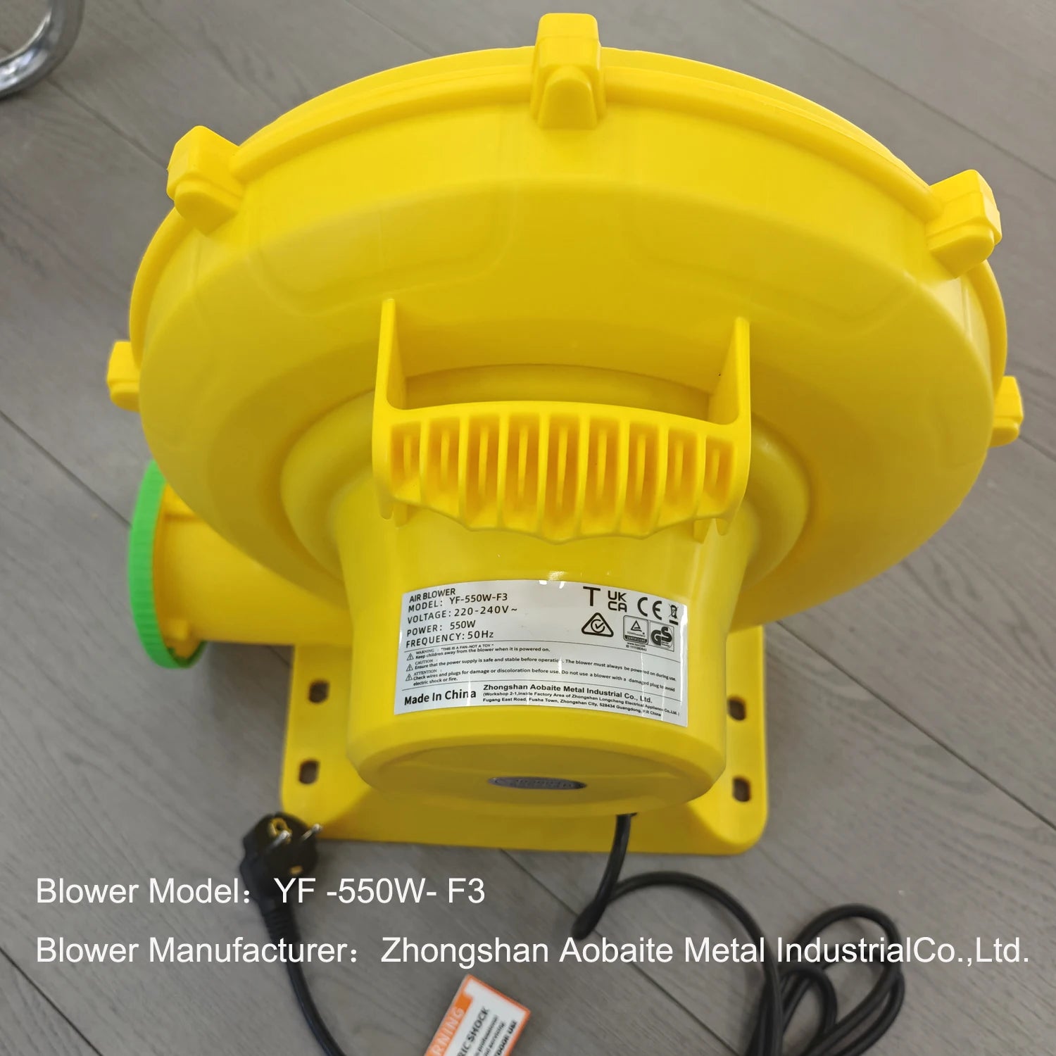 Giant Inflatable Tiki Bar supplier example of a yellow air blower with its model label and carrying handle