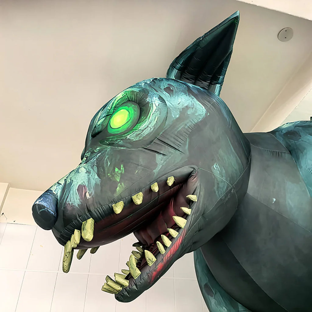 Giant Monster Wolf Inflatable left-facing head close-up showing green eye, pointed ear and oversized fangs
