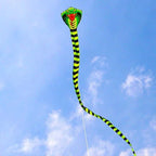 Giant Snake Kite flying at full length in a pale blue sky with its control line visible below