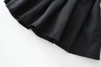 Girls Police Costume Set close-up of the black skirt fabric folds and stitched lower hem.