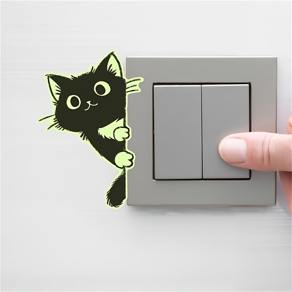 Glow Guide Cat Sticker beside a gray double light switch while a hand presses the switch