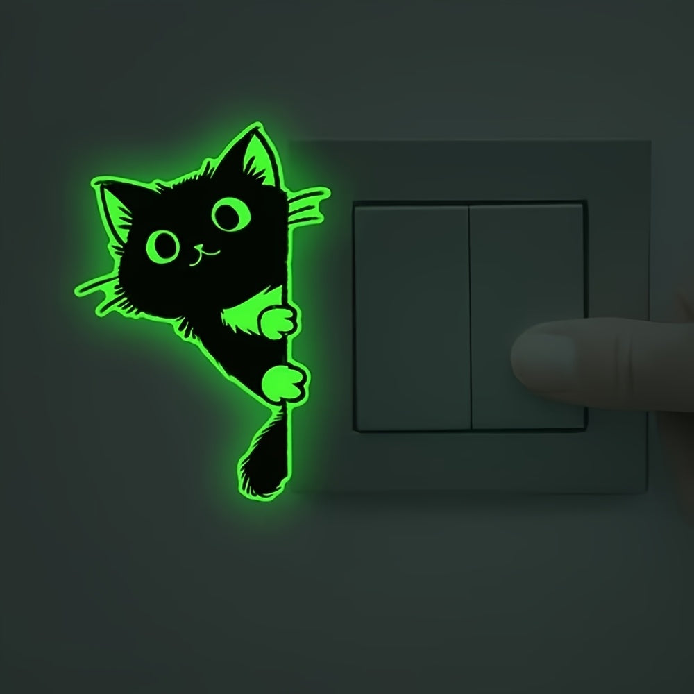 Glow Guide Cat Sticker glowing beside a dark light switch as a hand reaches toward it