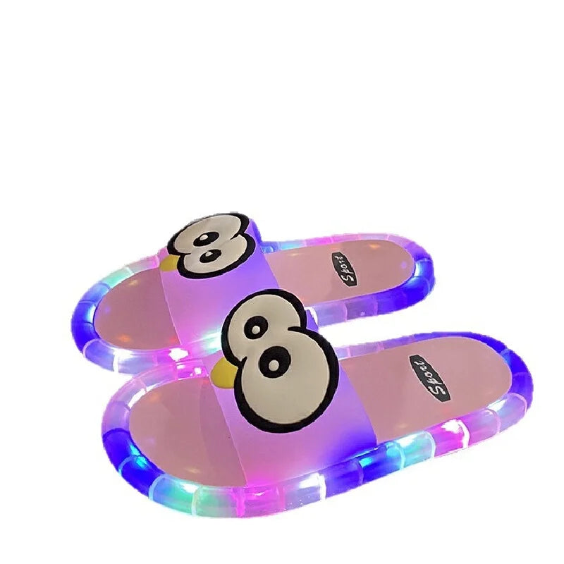 Pink Glowing Googly Eye Slides with illuminated multicolor soles on a white background