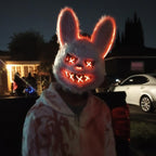 Glowing Horror Animal Masks bunny worn outdoors at night with a stained costume shirt
