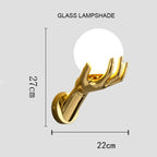 Golden Hand Wall Lamp — Glass shade size diagram showing 27 cm height and 22 cm horizontal span