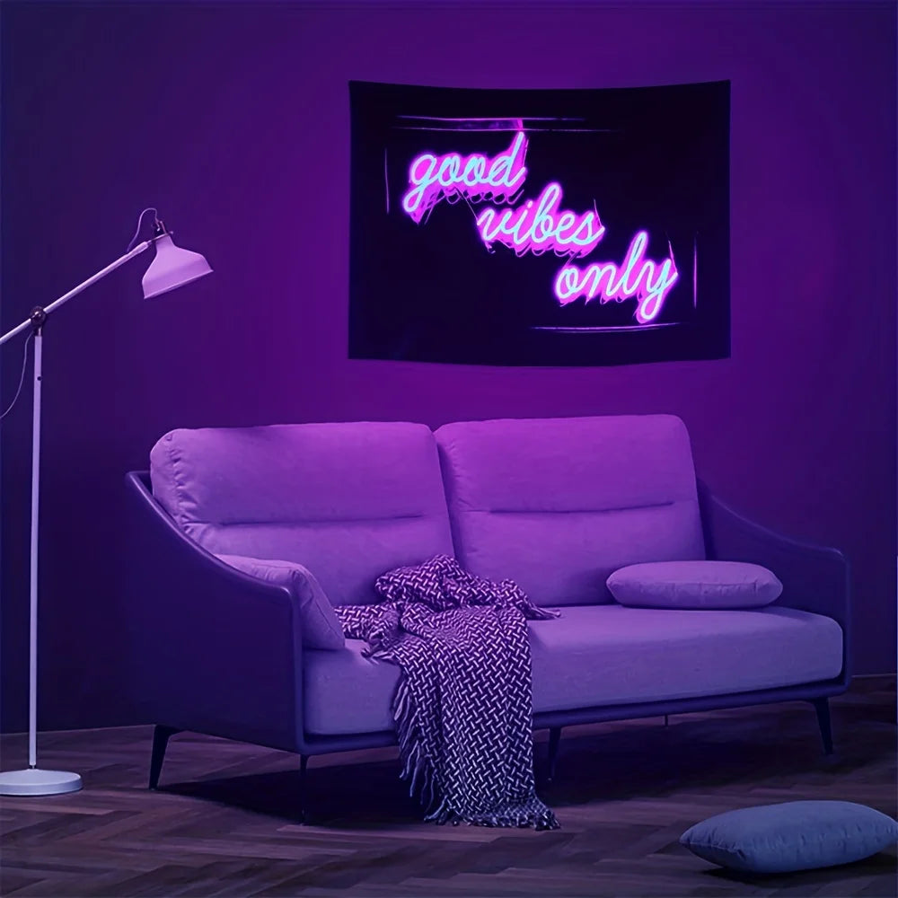 Good Vibes Only Tapestry hanging above a sofa beside a white floor lamp