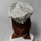 Granny Wolf Costume Mask rear view showing the floral cap and vertical opening in the head covering