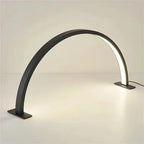Half Moon Nail Lamp in black, showing its curved LED strip, rectangular feet and attached power lead.