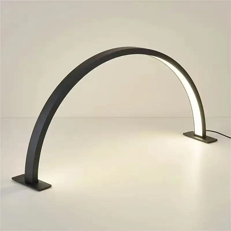Half Moon Nail Lamp in black, showing its curved LED strip, rectangular feet and attached power lead.