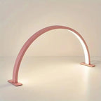 Half Moon Nail Lamp in pink with the LED strip illuminated along the inside of the curved arch.