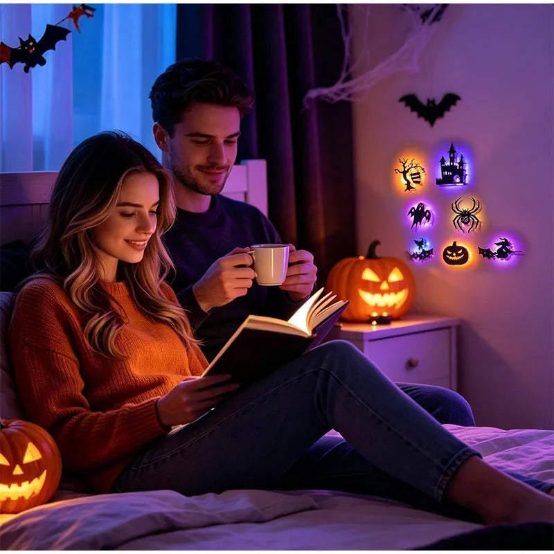 Halloween 3D Wall Lights above a bedside table in a Halloween bedroom where a couple relaxes with a book.