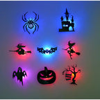 Halloween 3D Wall Lights close-up of eight black cutout designs surrounded by blue, pink and red illumination.