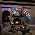 Halloween 3D Wall Lights arranged above a fireplace and around archways in a cozy decorated living room.