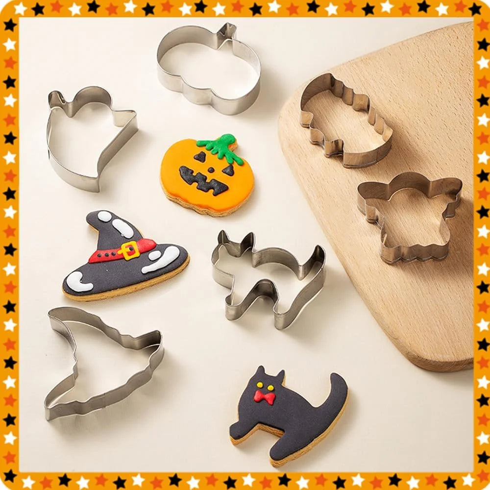 Halloween Cookie Cutter Set arranged with decorated cookies and rolled dough on a wooden board.