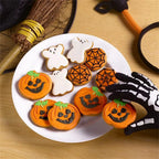 Halloween Cookie Cutter Set results displayed as decorated pumpkin, ghost, and spider web cookies.
