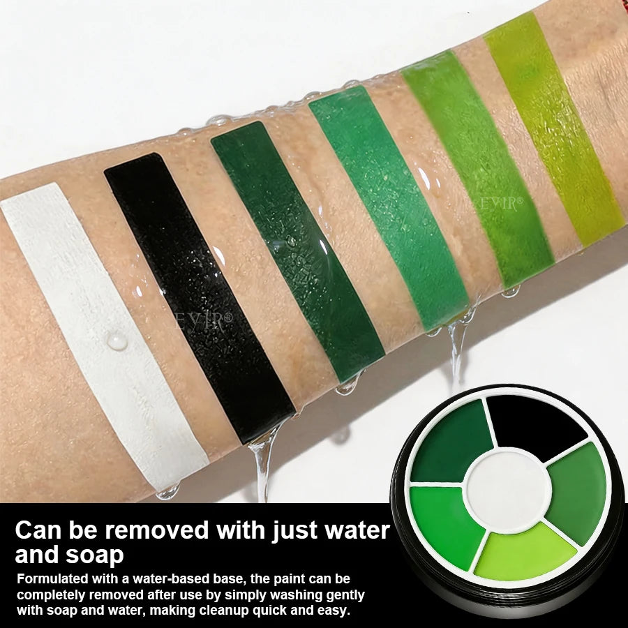Halloween Face Paint Kit: Paint swatches on an arm under water with soap-and-water removal instructions.