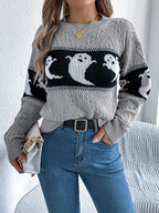 Halloween Ghost Knit Sweater gray colorway styled with blue jeans and a light handbag at the side