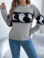 Halloween Ghost Knit Sweater in gray shown from the front with both sleeves raised to display the knit