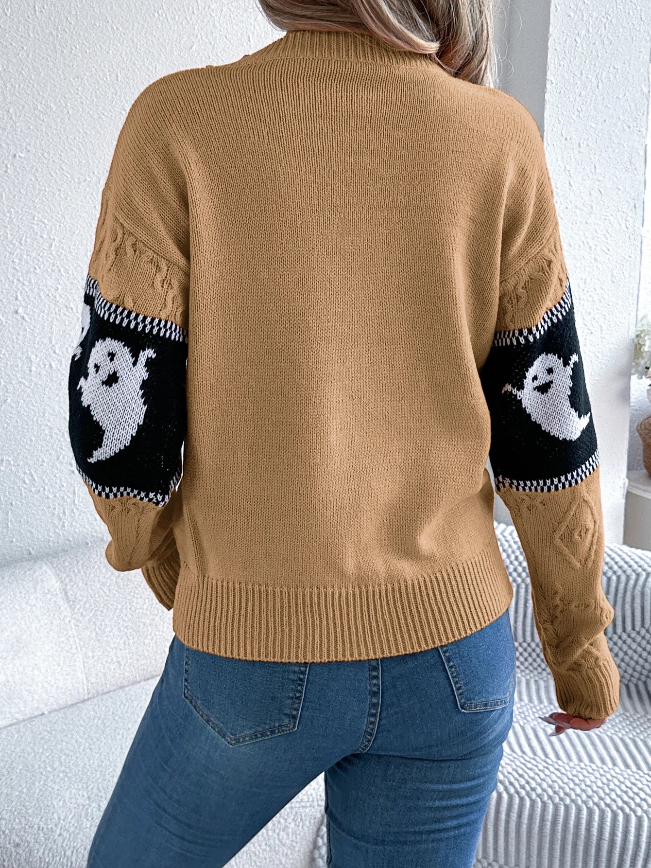 Halloween Ghost Knit Sweater khaki back view showing solid knit body and black ghost-pattern sleeve bands