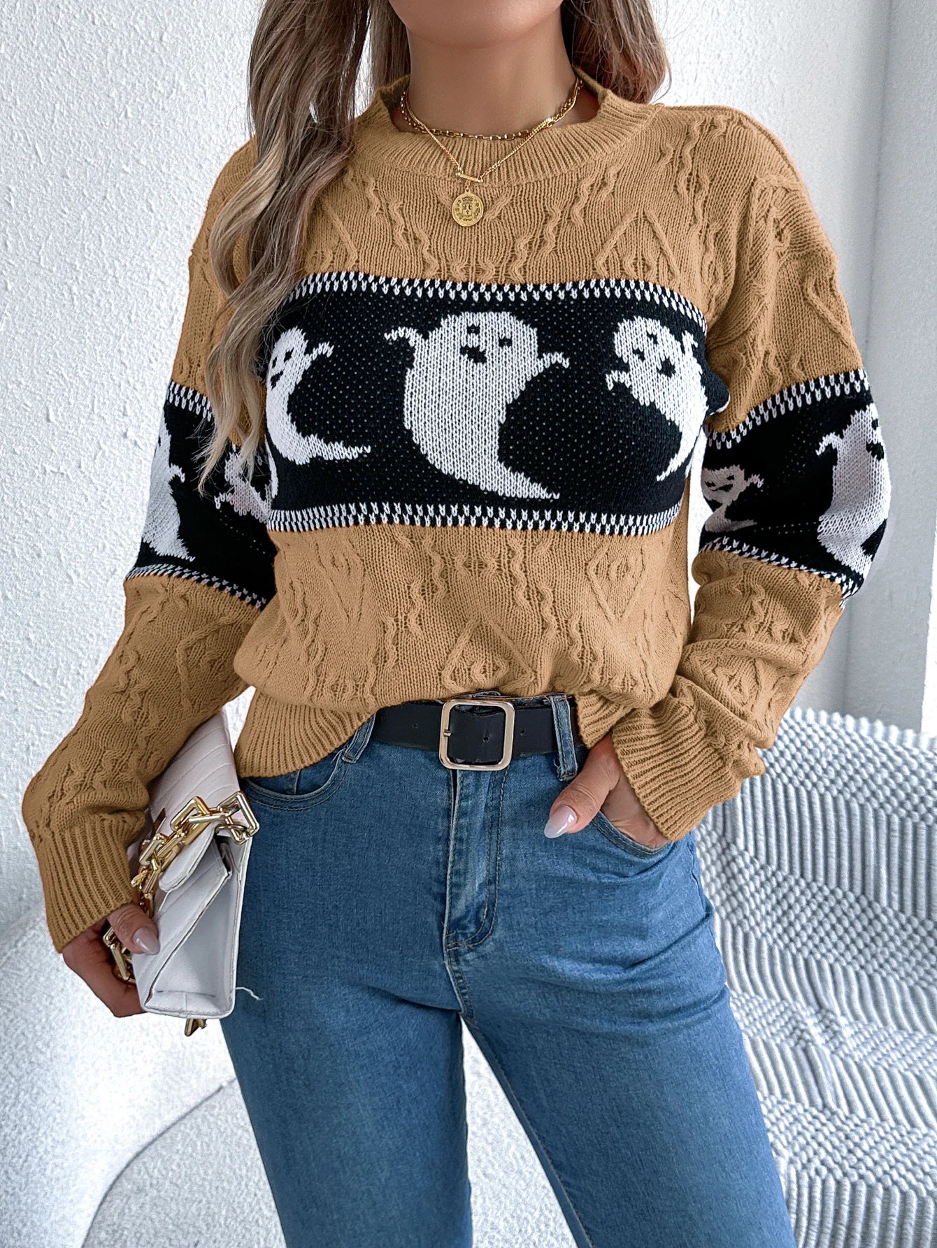 Halloween Ghost Knit Sweater khaki colorway front styling view with blue jeans and a light handbag