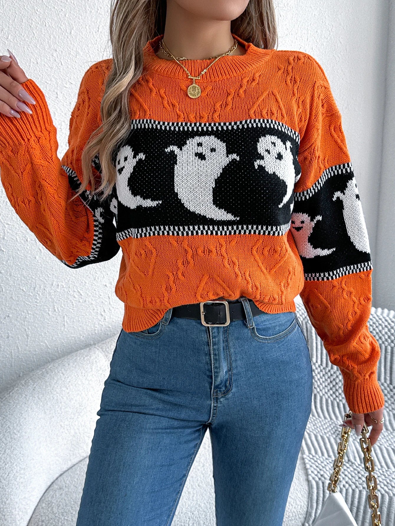 Halloween Ghost Knit Sweater orange full front view showing long sleeves and white ghosts on black stripe