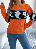 Halloween Ghost Knit Sweater in orange front styling view with raised sleeves and round neckline visible