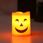 Halloween Pumpkin LED Candle Set: close-up of the glowing candle with closed crescent eyes and a wide smile.