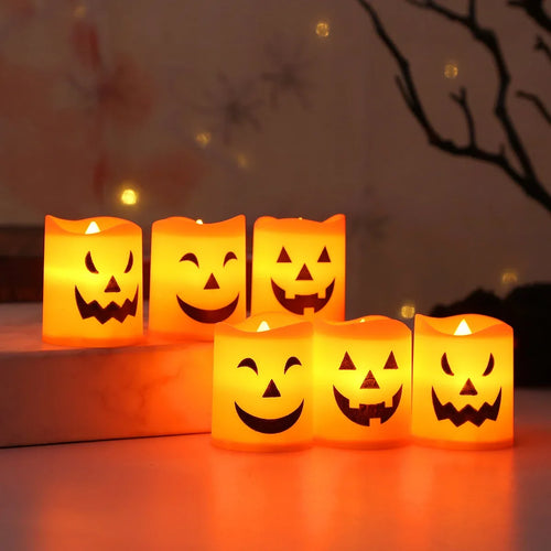 Halloween Pumpkin LED Candle Set: six glowing pumpkin candles arranged in two rows at different heights.