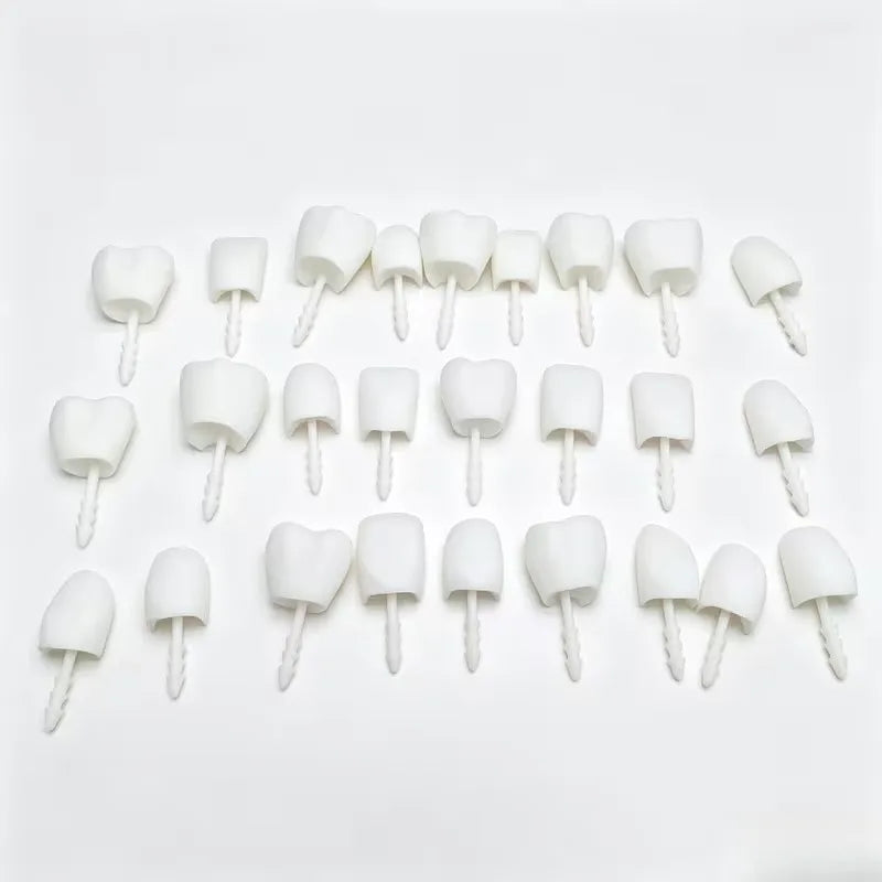 Halloween Pumpkin Teeth Inserts round set laid out in three rows with pointed mounting stems
