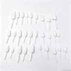 Halloween Pumpkin Teeth Inserts sharp fangs in assorted sizes arranged on a white background