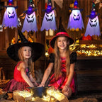Halloween Witch Hat Lanterns hanging above two children in costumes at a festive Halloween party