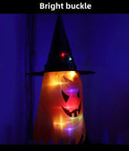 Halloween Witch Hat Lanterns orange design glowing in a dark room with the hat buckle illuminated