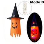 Halloween Witch Hat Lanterns in orange, shown unlit and glowing with a jack-o’-lantern face